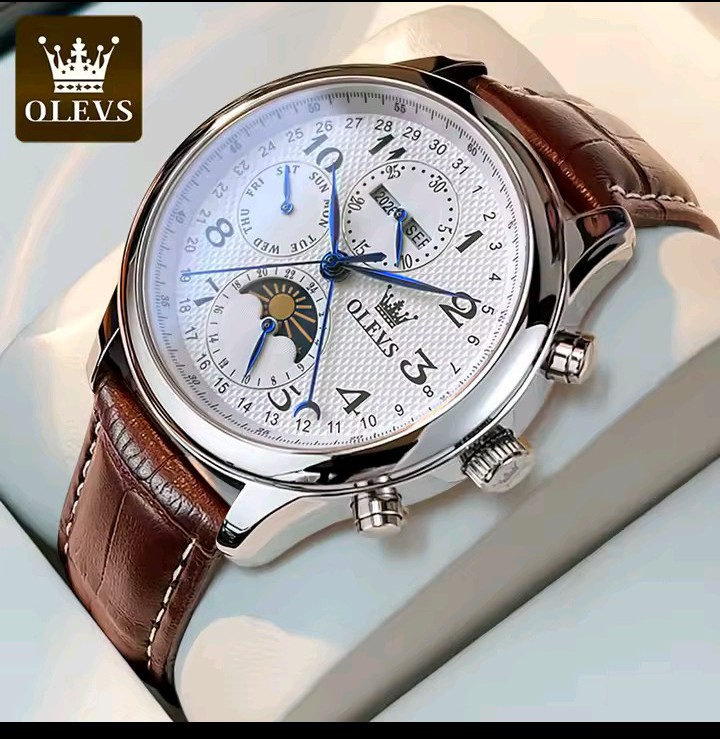 Close view of the OLEVS watch with leather strap